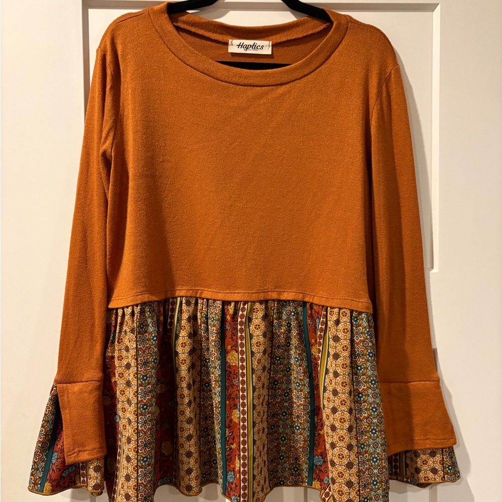 Three Bird Nest Rust Orange Long Sleeve Peplum Blouse with Patterned Hem